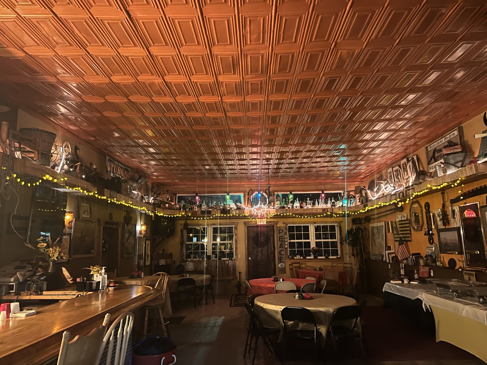 The pine-timbered dining room at The Emporium, walls covered in western memorabilia